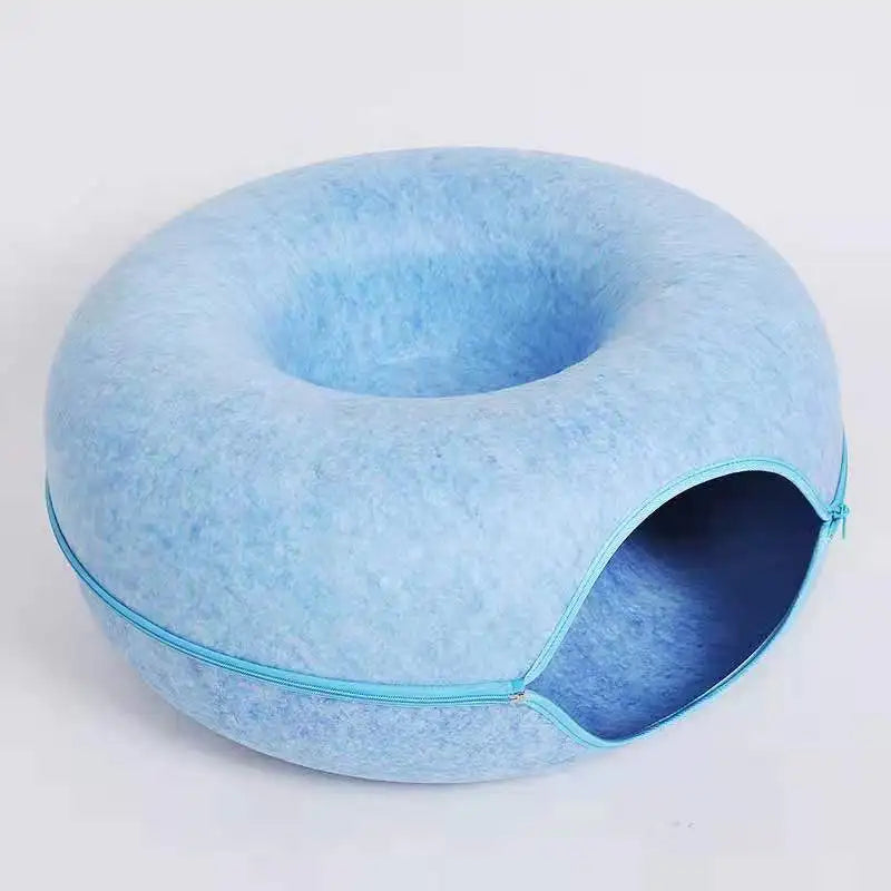 Cat playing in the felt tunnel